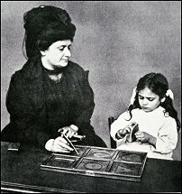 Dr. Maria Montessori is teaching a girl